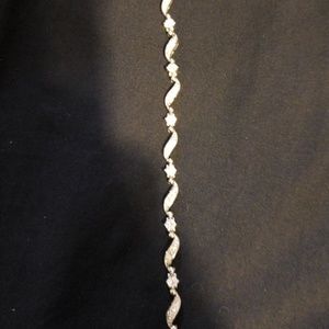 Silver tone bracelet with cz stones.